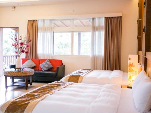 绿庄飞阁渡假会馆客房内的一张或多张床位