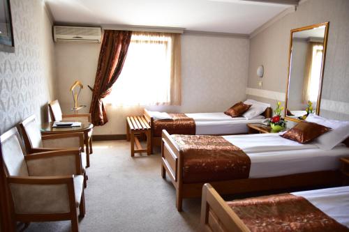 加尼拉佛酒店客房内的一张或多张床位