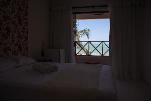 Pousada Nossa Ilha客房内的一张或多张床位
