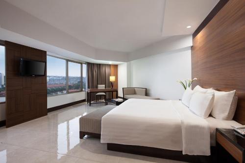 桑提卡三宝垄酒店客房内的一张或多张床位