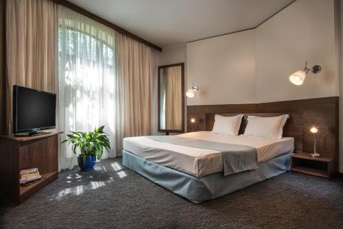 Uniqato Hotel客房内的一张或多张床位