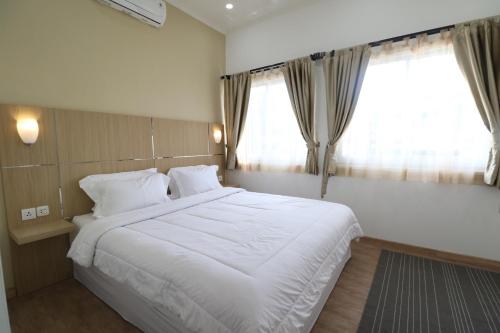 Diyar Villas Puncak K3/2A客房内的一张或多张床位