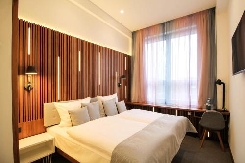 H24柏林里斯特恩布尔格酒店客房内的一张或多张床位