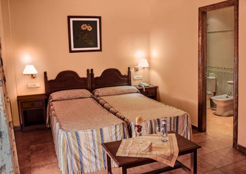 阿萨多阿尔本扎酒店客房内的一张或多张床位