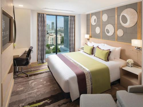 Solitaire Bangkok Sukhumvit 11客房内的一张或多张床位