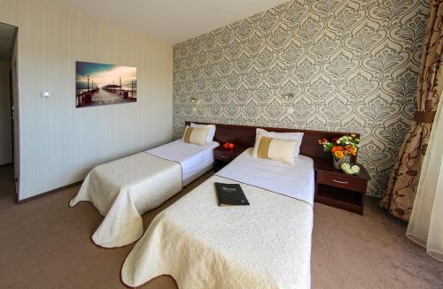 Hotel Spa Terma客房内的一张或多张床位