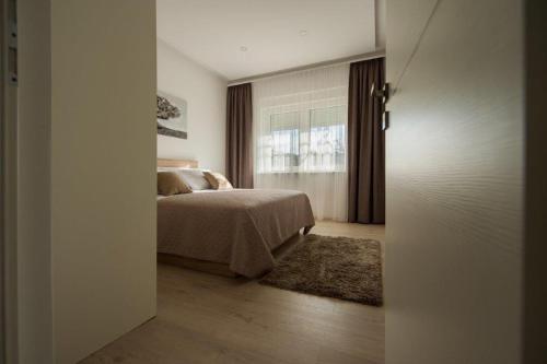 Apartment Sunce客房内的一张或多张床位