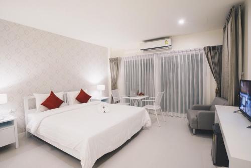 Shunli Hotel - SHA Extra Plus客房内的一张或多张床位