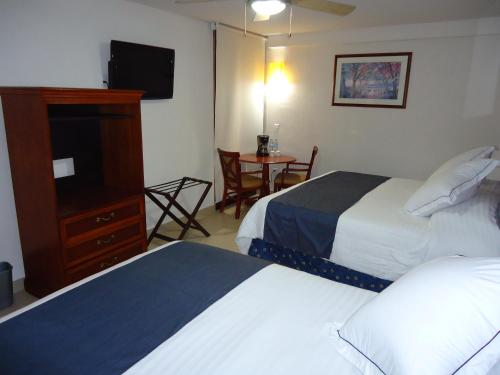 巴亚尔塔港阿雷格里港酒店客房内的一张或多张床位