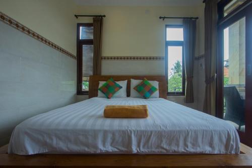 杰普巴厘岛乌布民宿客房内的一张或多张床位