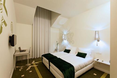 HD|杜埃西塔尼亚设计酒店客房内的一张或多张床位