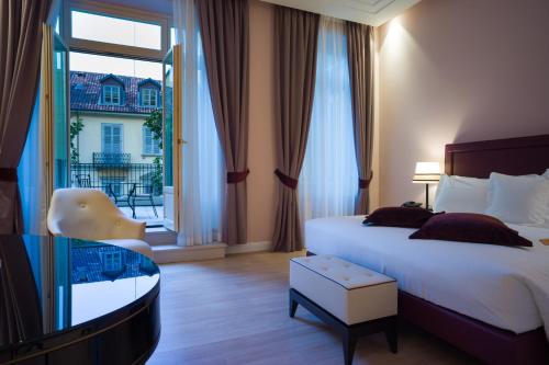 都灵宫殿酒店客房内的一张或多张床位