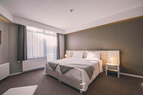 诺瓦本特巴萨酒店客房内的一张或多张床位