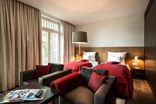 思德赫索斯酒店客房内的一张或多张床位