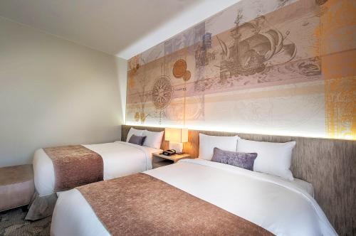 关岛莱昂广场度假酒店客房内的一张或多张床位