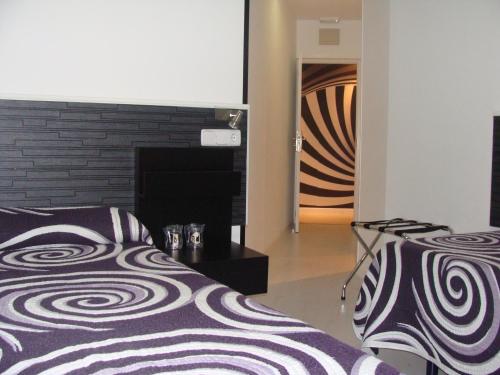 JQ马德里1号旅馆客房内的一张或多张床位