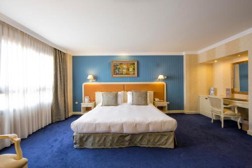 欧洲之星阿拉瓜尼酒店客房内的一张或多张床位