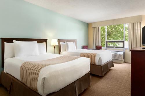 悉尼新斯科舍省旅程酒店客房内的一张或多张床位