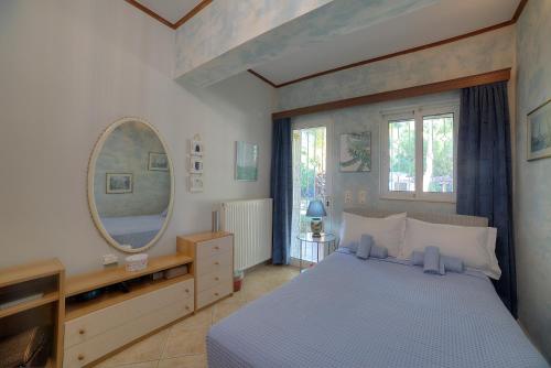 Villa Sunrise Lagonisi客房内的一张或多张床位