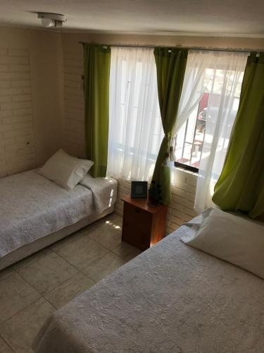 Bahia Inglesa Apartamentos客房内的一张或多张床位