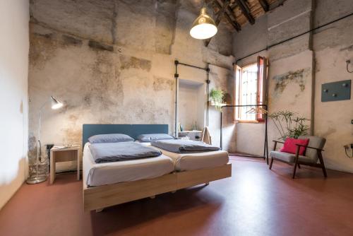 Un posto a Milano - guesthouse all'interno di una cascina del 700客房内的一张或多张床位