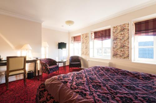 格瑞斯库伽米勒酒店客房内的一张或多张床位