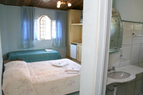 Pousada Bariloche客房内的一张或多张床位