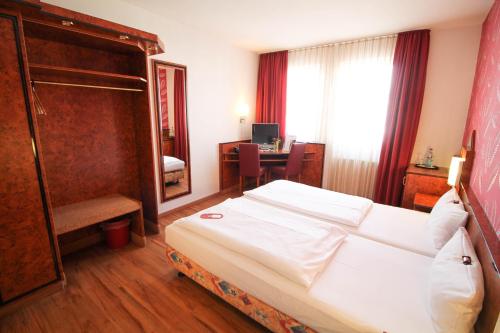 Hotel Miramar am Römer客房内的一张或多张床位