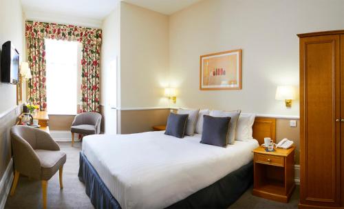 里维埃拉镇别墅酒店客房内的一张或多张床位