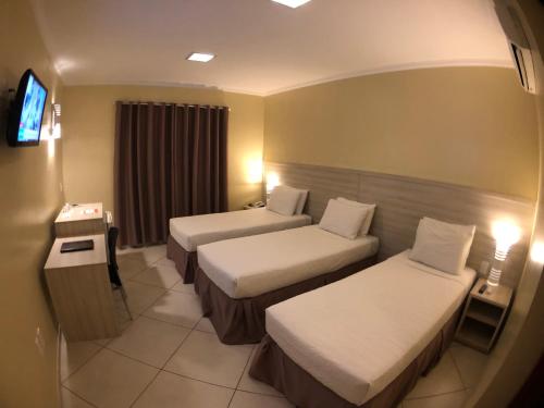 Garoto Park Hotel客房内的一张或多张床位