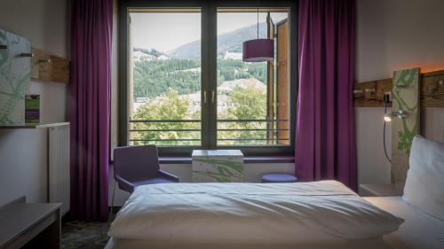 Explorer Hotel Zillertal客房内的一张或多张床位