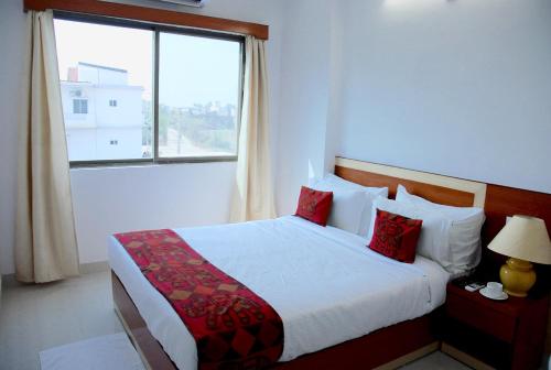 菩提迦耶酒店学校客房内的一张或多张床位