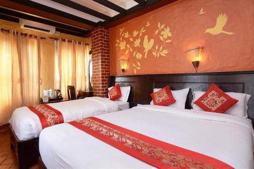 卡萨曼达精品酒店客房内的一张或多张床位