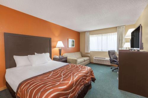 米德兰贝蒙特旅馆套房酒店客房内的一张或多张床位
