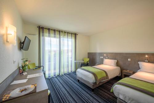 国际之家沙塔尔酒店客房内的一张或多张床位