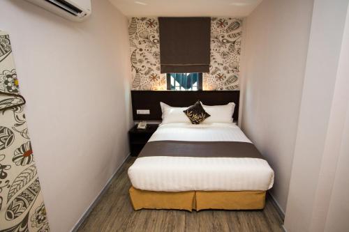 吉隆坡中心双M酒店客房内的一张或多张床位