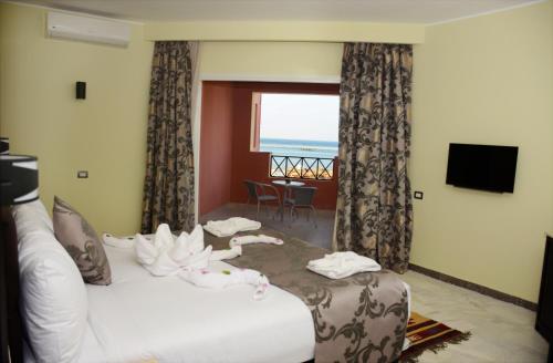 Casa Mare Resort - ex, Royal Tulip Beach Resort客房内的一张或多张床位