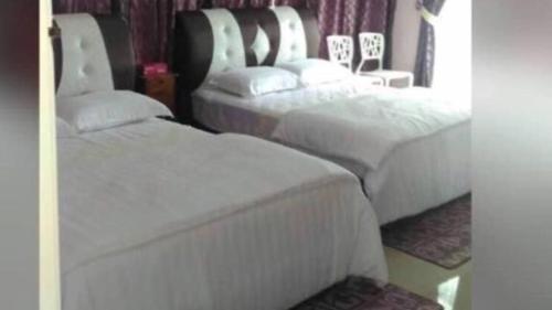 Paka Tamim Seaview Hotel客房内的一张或多张床位