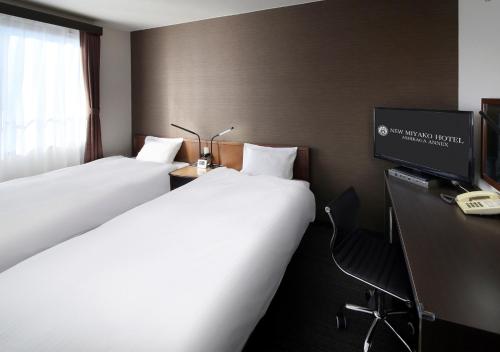 新宫古酒店足利别馆客房内的一张或多张床位