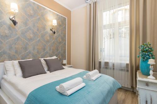 Anno Domini Apartment by Cozyplace客房内的一张或多张床位
