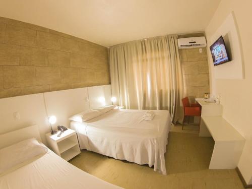 Hotel São Marcos客房内的一张或多张床位