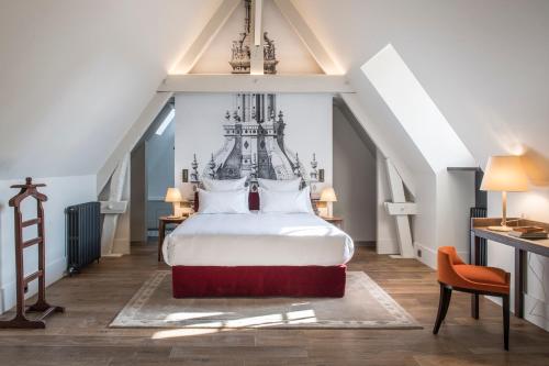 查博德世界小型豪华酒店客房内的一张或多张床位