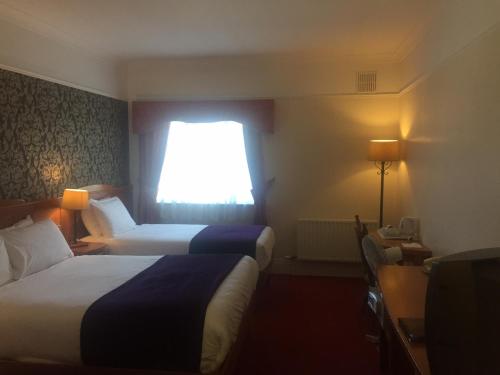 基尔福德亚姆斯酒店客房内的一张或多张床位