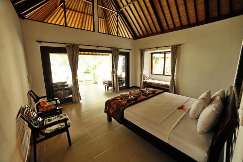 巴厘岛梦想之家酒店客房内的一张或多张床位