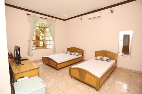 Khách sạn Cà Ná客房内的一张或多张床位