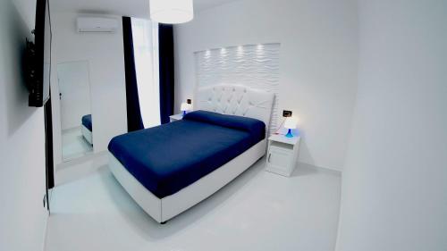 贝维雷洛套房旅馆客房内的一张或多张床位