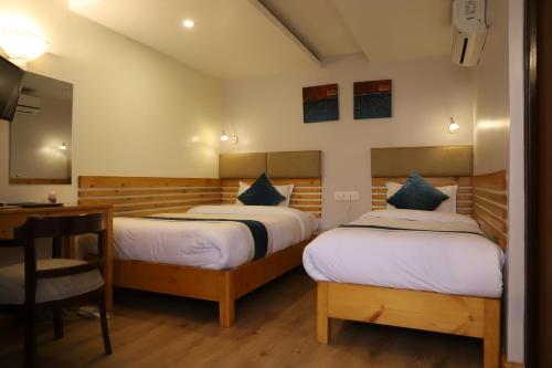 尼泊尔小屋酒店客房内的一张或多张床位