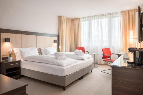 Leoso Hotel Leverkusen客房内的一张或多张床位