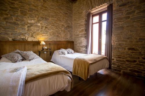 La Casona de Sarria客房内的一张或多张床位