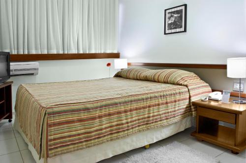 福莱特巴萨诺瓦卡里尼酒店客房内的一张或多张床位